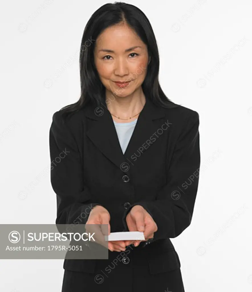 Asian businesswoman offering business card