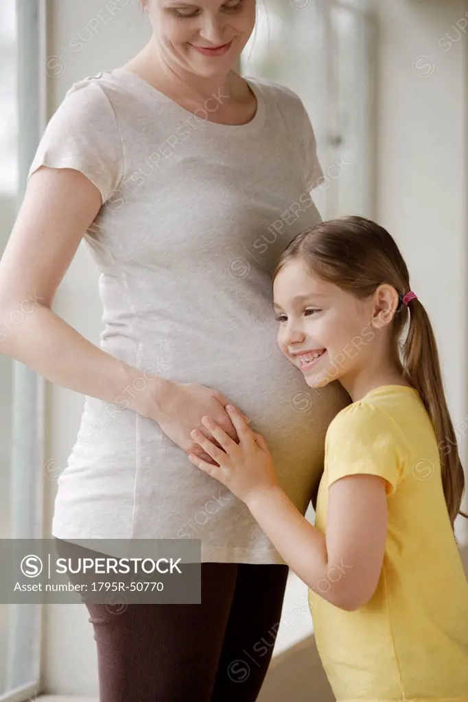 Pregnant woman with daughter 6_7