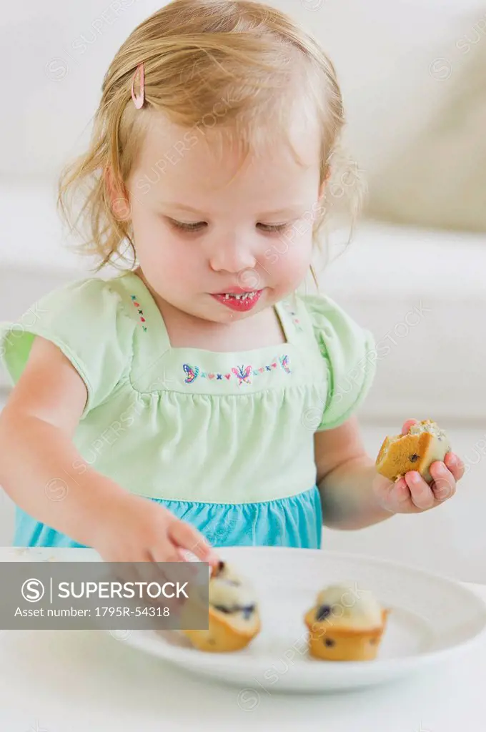 Girl 2_3 eating muffins