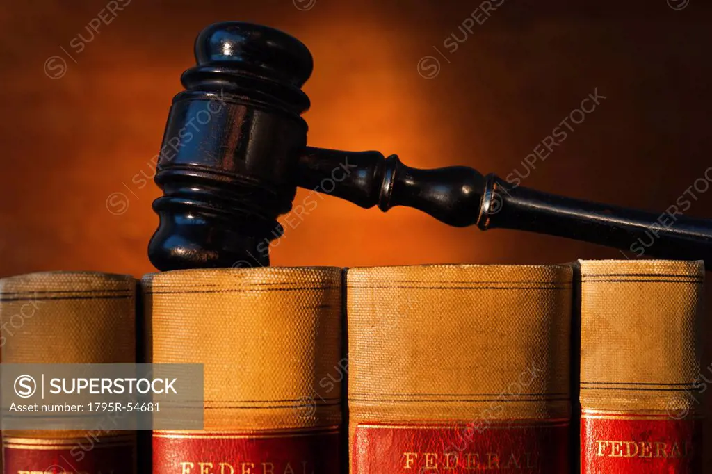 Close_up of gavel on lawyer books