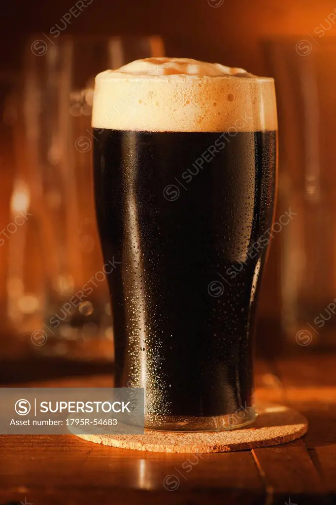 Ale in beer glass on bar counter