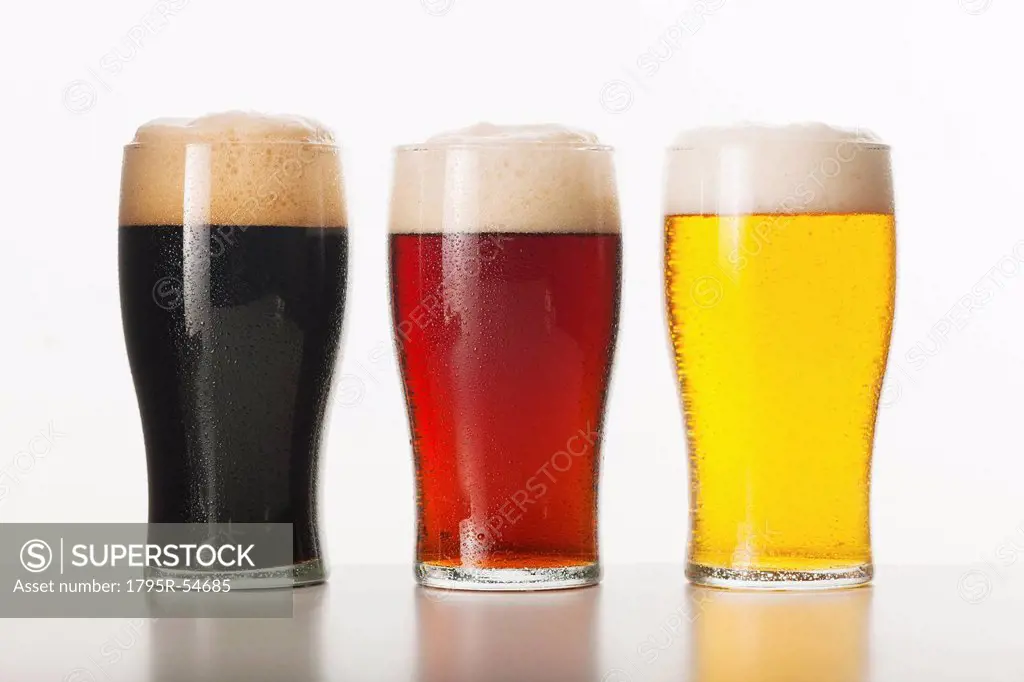 Three beers in glasses, studio shot