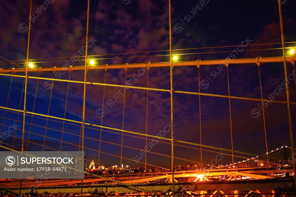USA, New York State, New York City, Midtown Manhattan and Brooklyn Bridge at night