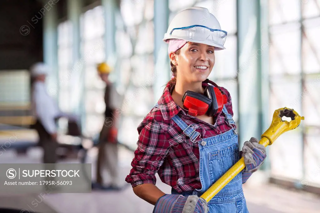 Portrait of female manual worker wearing hardhat