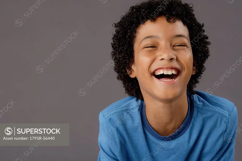 Portrait of laughing boy 8_9, studio shot