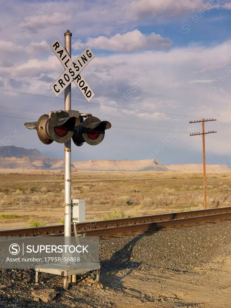 USA, Utah, Desert landscape with railroad crossing