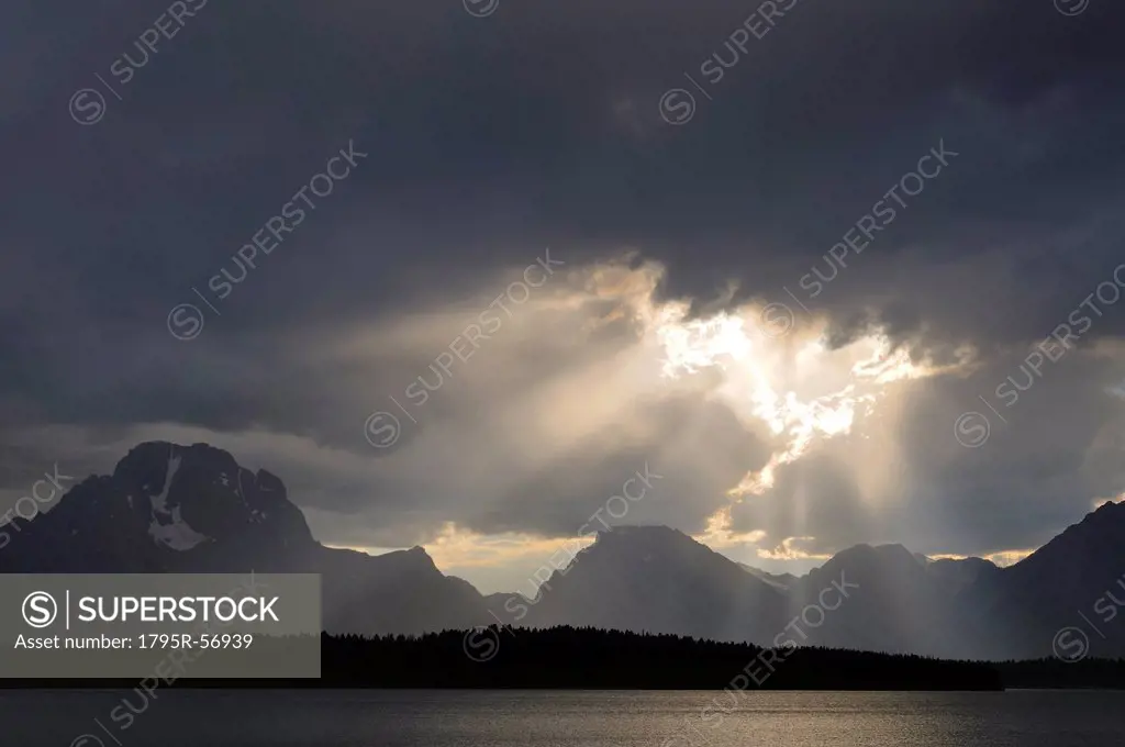 USA, Grand Teton National Park, Sunrays breaking through storm clouds