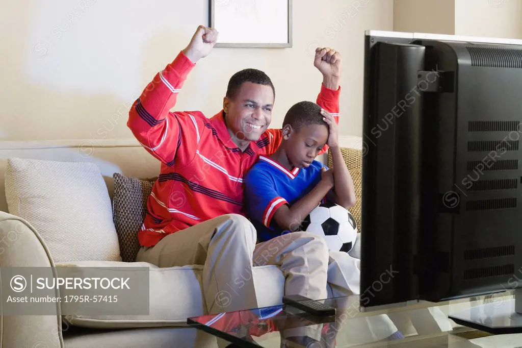 Father and Son 12_13 watching sports on tv