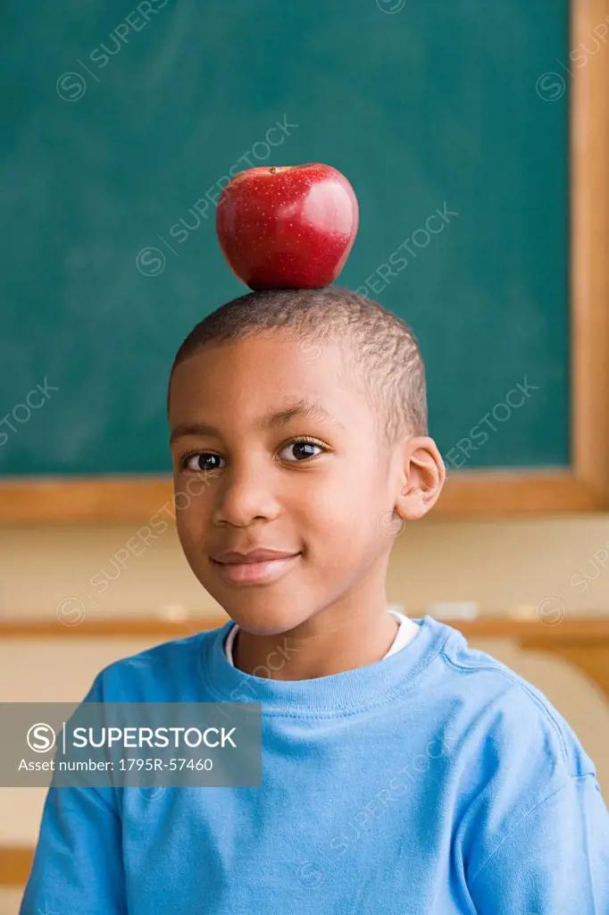Boy 6_7 with apple on head