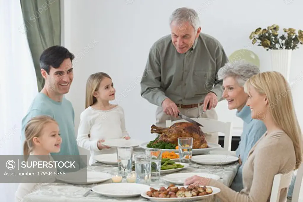 Family eating at Thanksgiving table