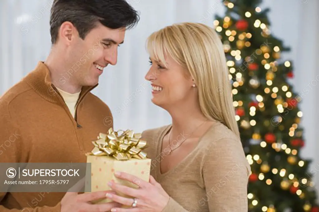 Couple holding Christmas gift