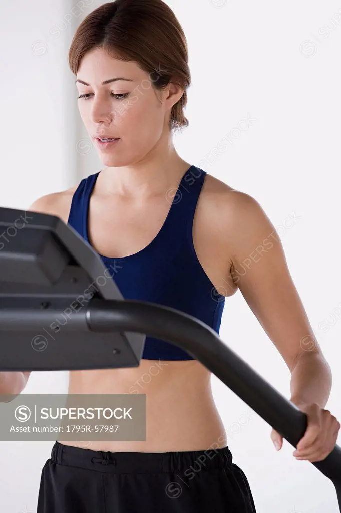 Woman training on treadmill
