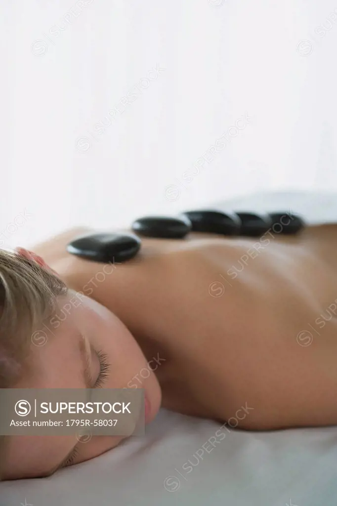Woman enjoying hot stone therapy