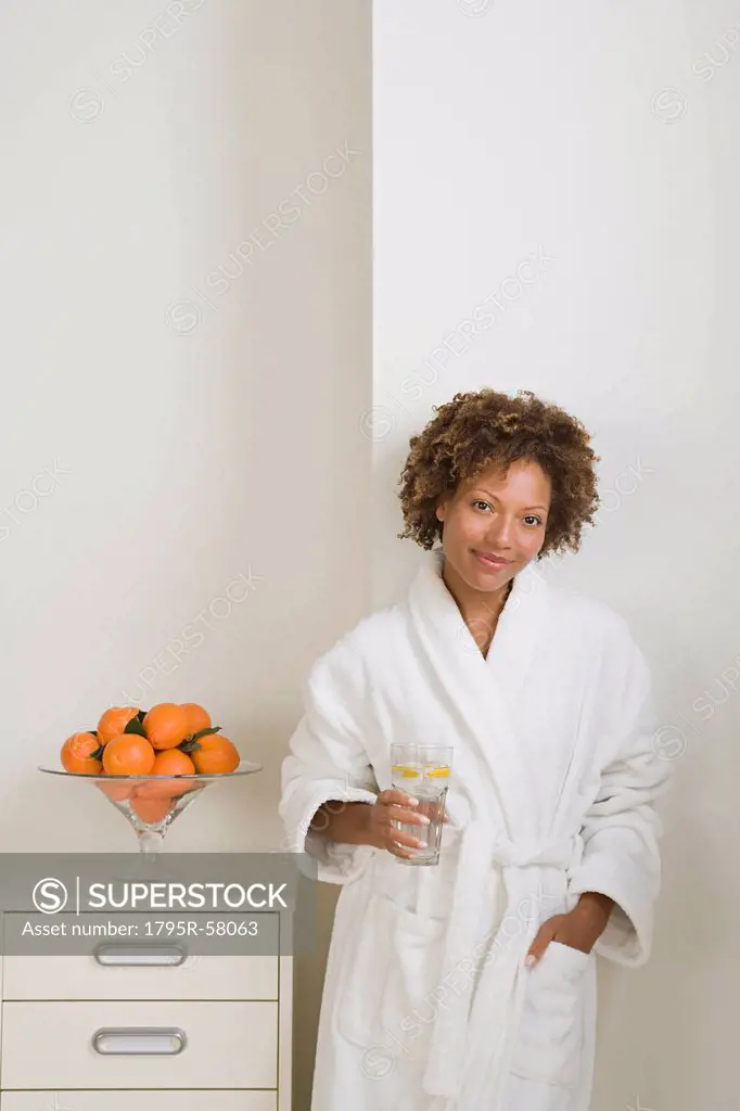 Attractive woman drinking fresh orange juice