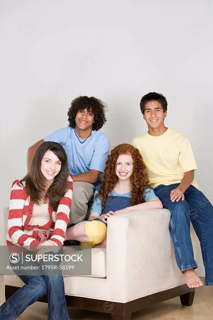 Portrait of teenagers 14_15,16_17 sitting on armchair