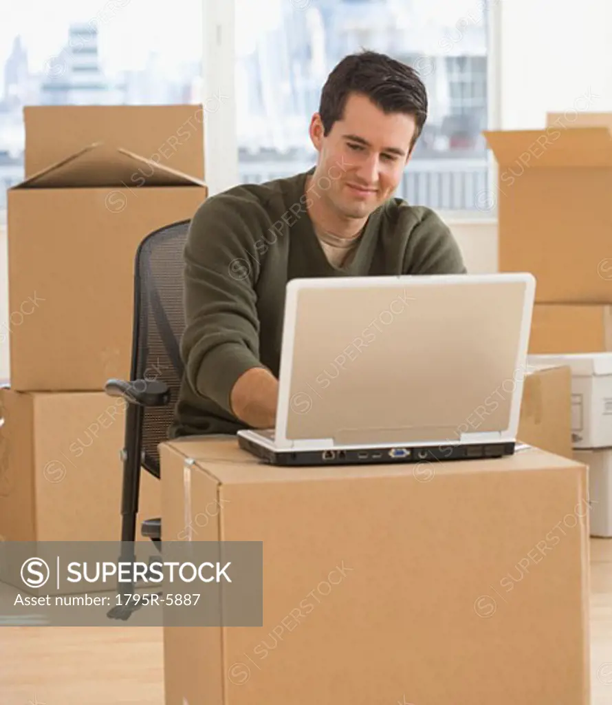 Businessman working in new office