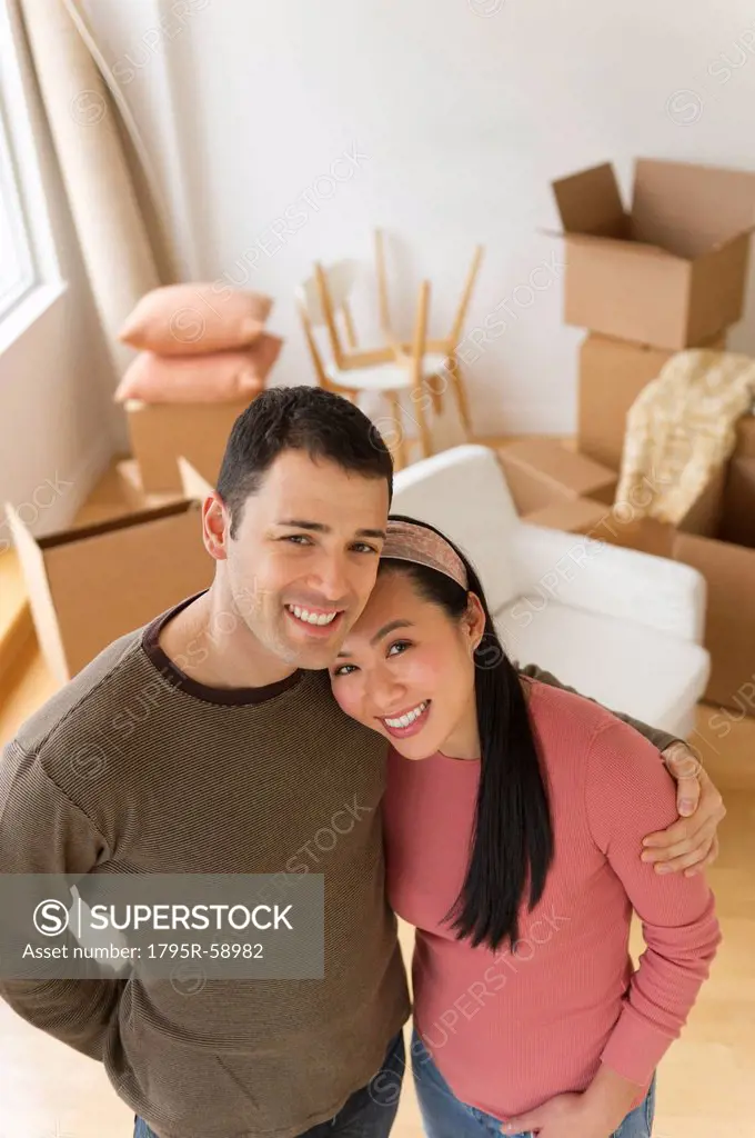 Portrait of couple in new house