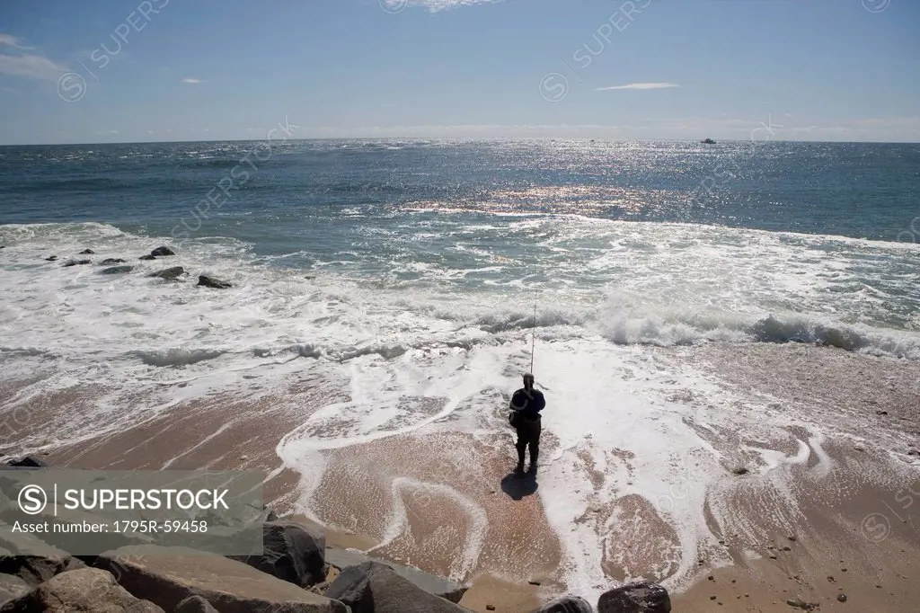 USA, New York, Long Island, Montaurk, Man fishing in sea