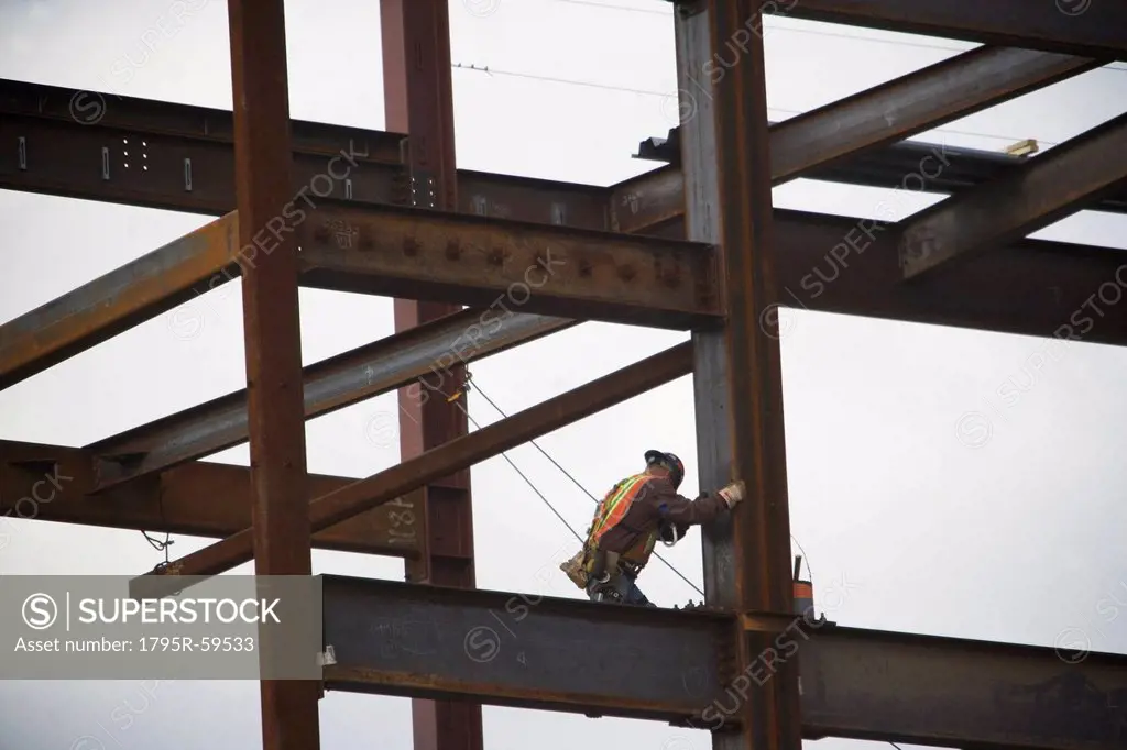 Construction worker working on unfinished structure
