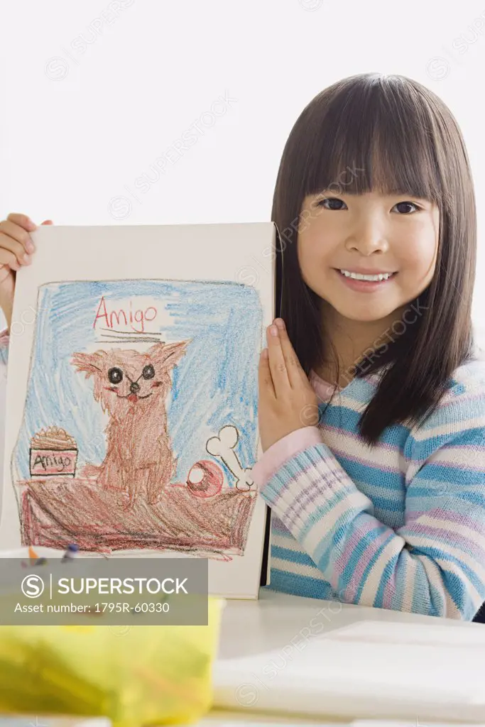 Girl (6-7) showing her drawing
