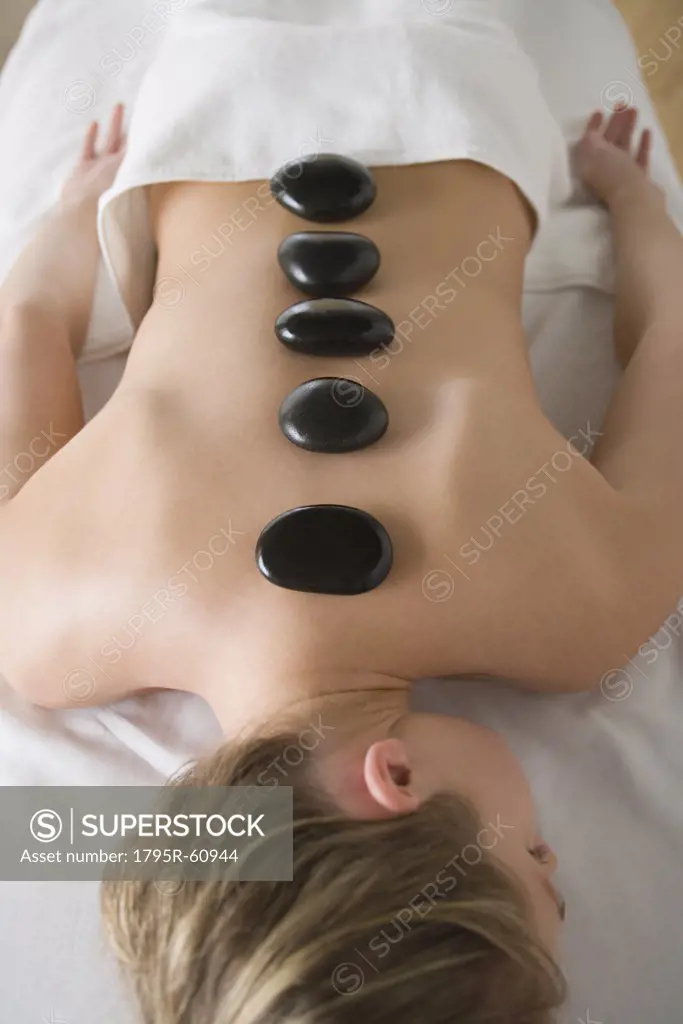 Woman enjoying hot stone therapy