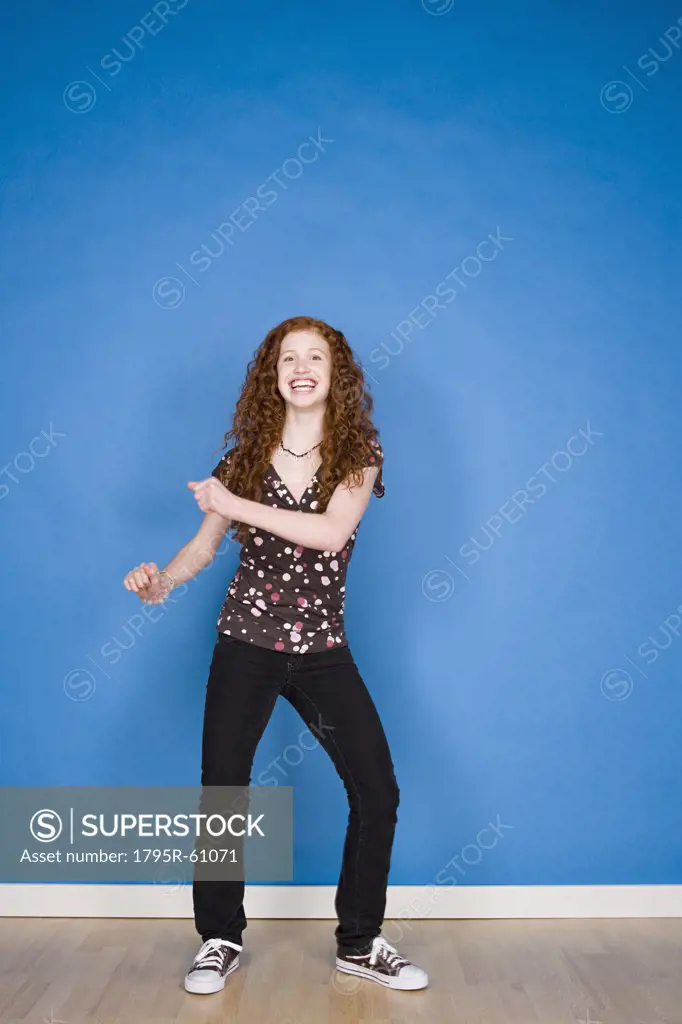 Portrait of teenage girl (16-17) dancing