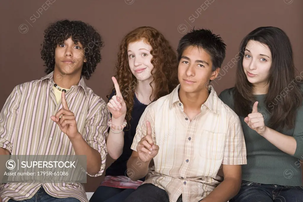 Portrait of teenagers (14-15,16-17) with fingers up