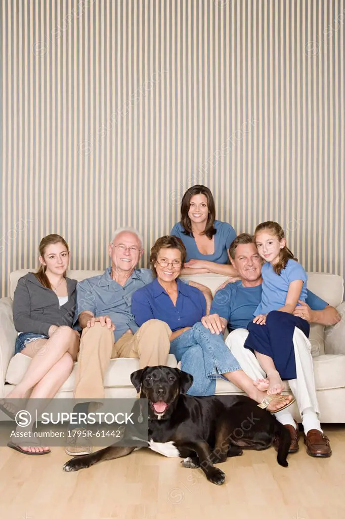 Portrait of three_generation family with two girls 8_9, 14_15 and dog