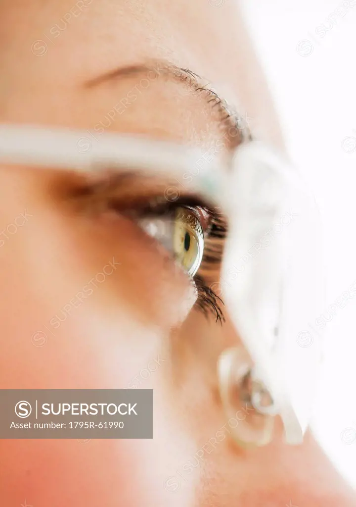 Studio close_up of woman wearing eyeglasses
