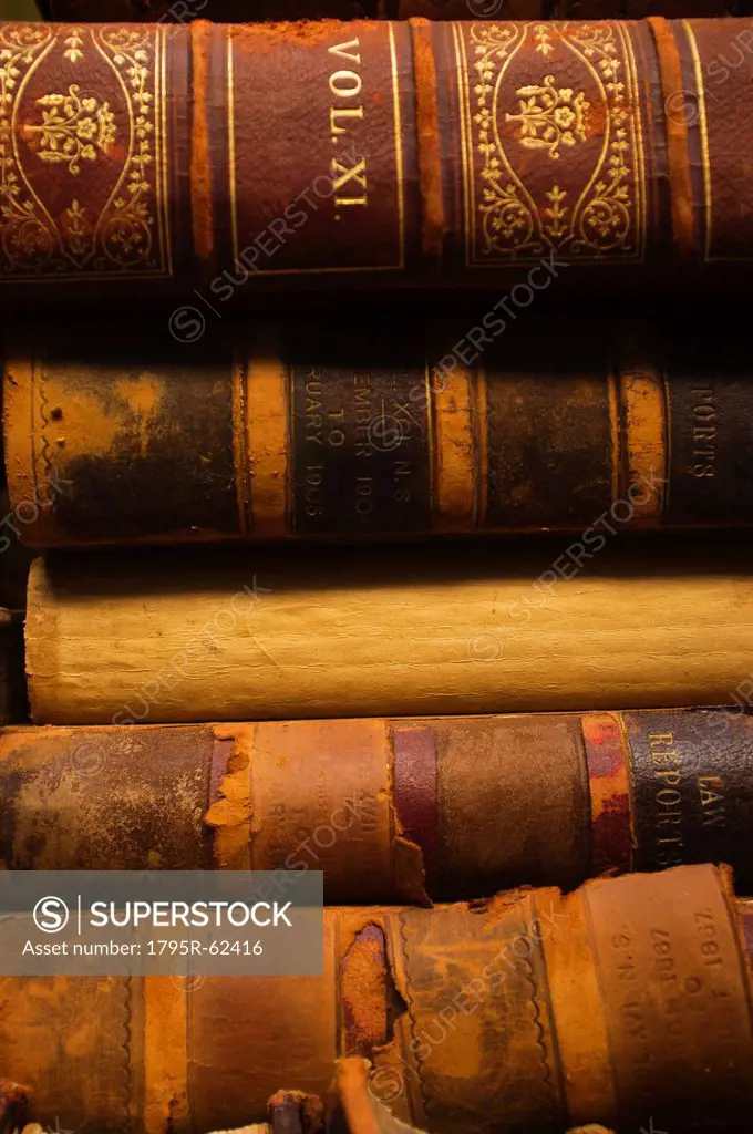 Close up of antique books in leather covers, studio shot
