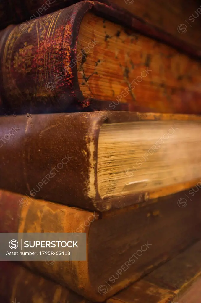 Close up of antique books in leather covers, studio shot