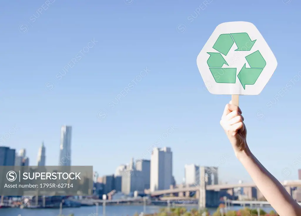 USA, New York State, New York City, Manhattan, Hand holding recycling symbol