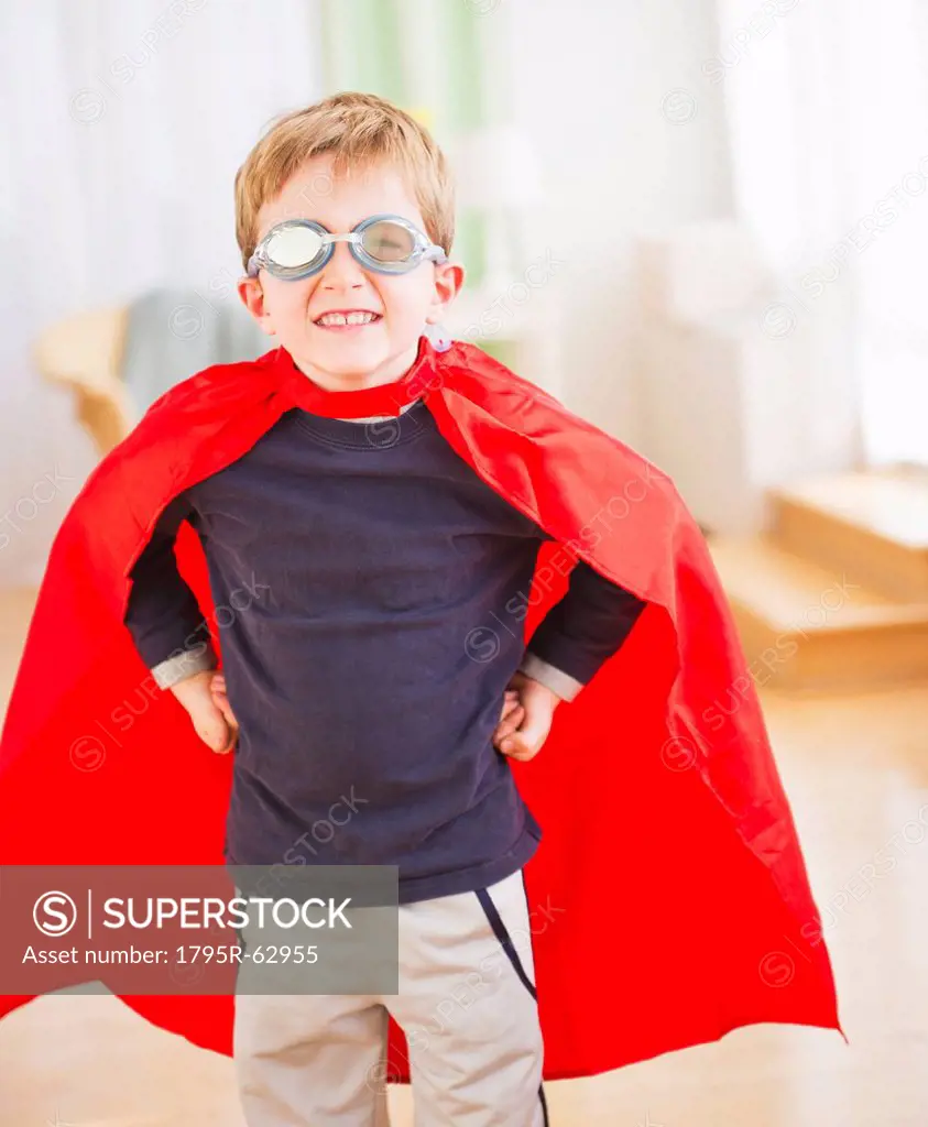 Portrait of boy 6_7 wearing superhero costume