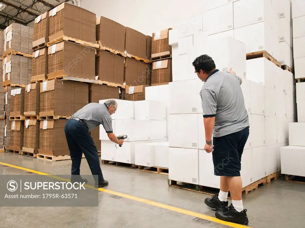 Warehouse workers scanning delivery