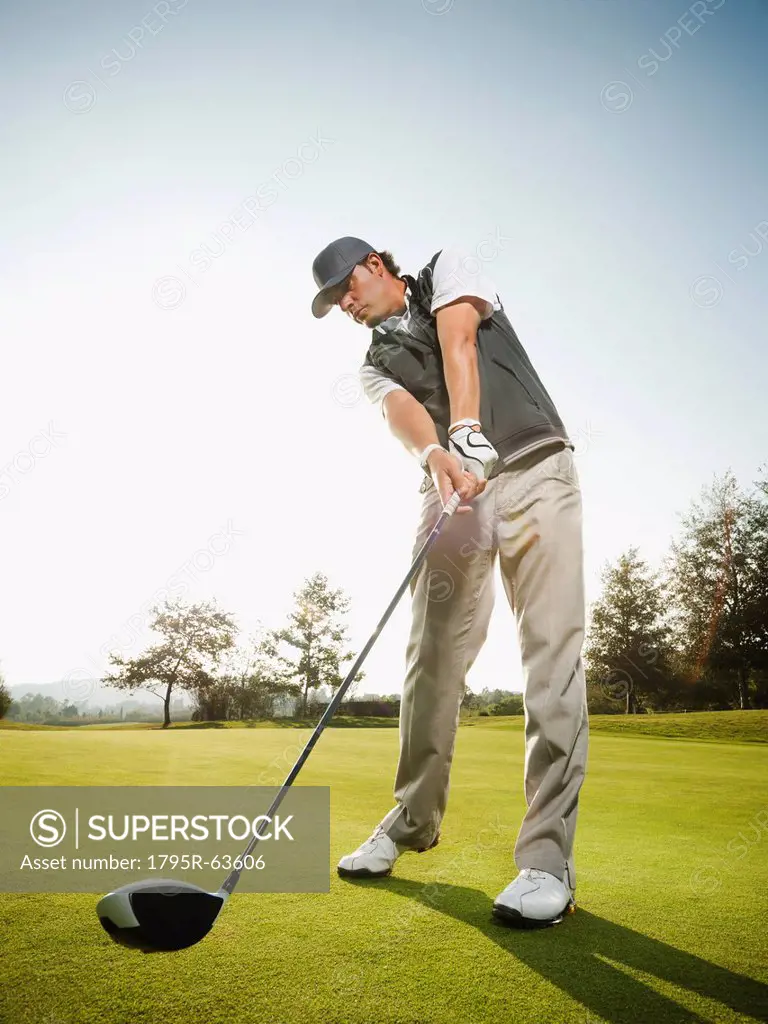 USA, California, Mission Viejo, Low angle view of man playing golf