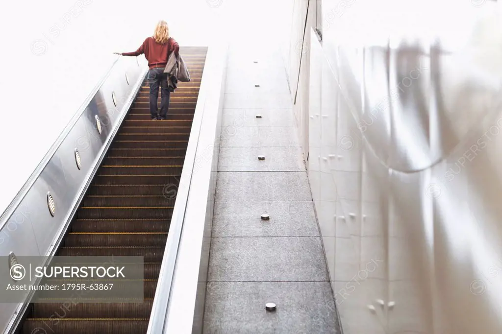 USA, California, Los Angeles, Woman on escalator in subway station