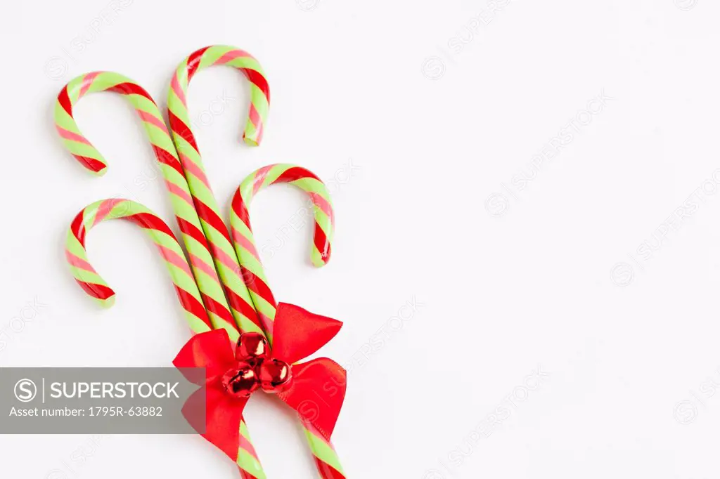 Striped candy canes with red ribbon, studio shot