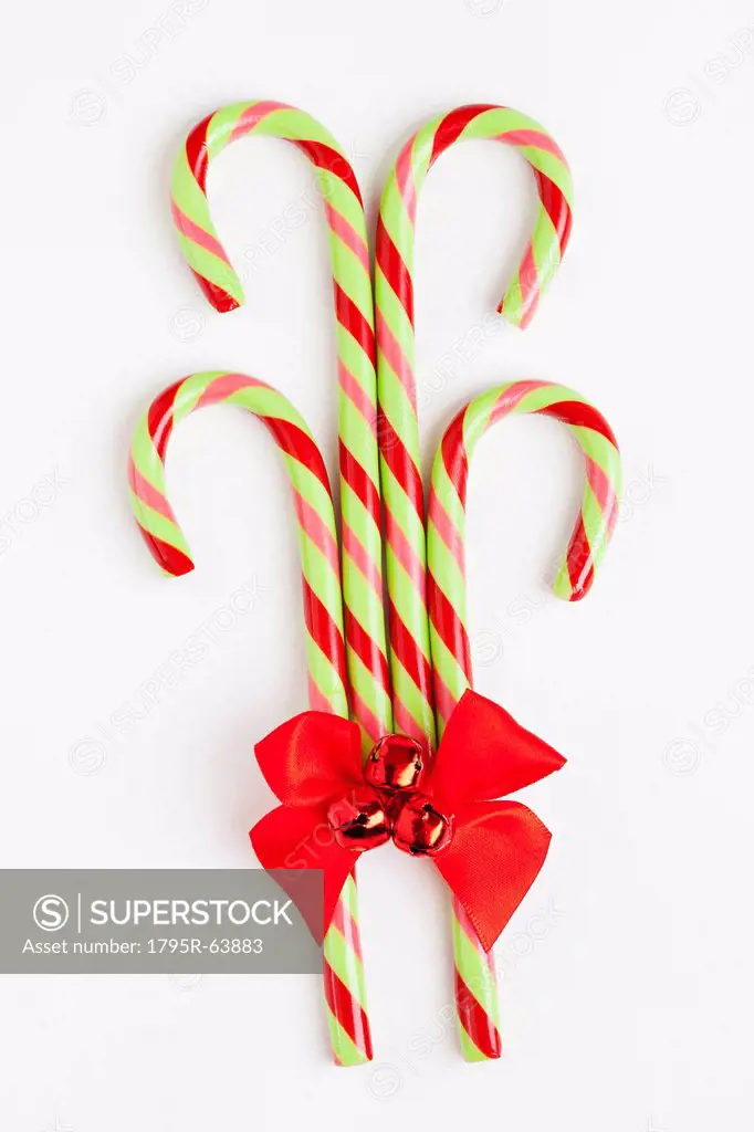 Striped candy canes with red ribbon, studio shot