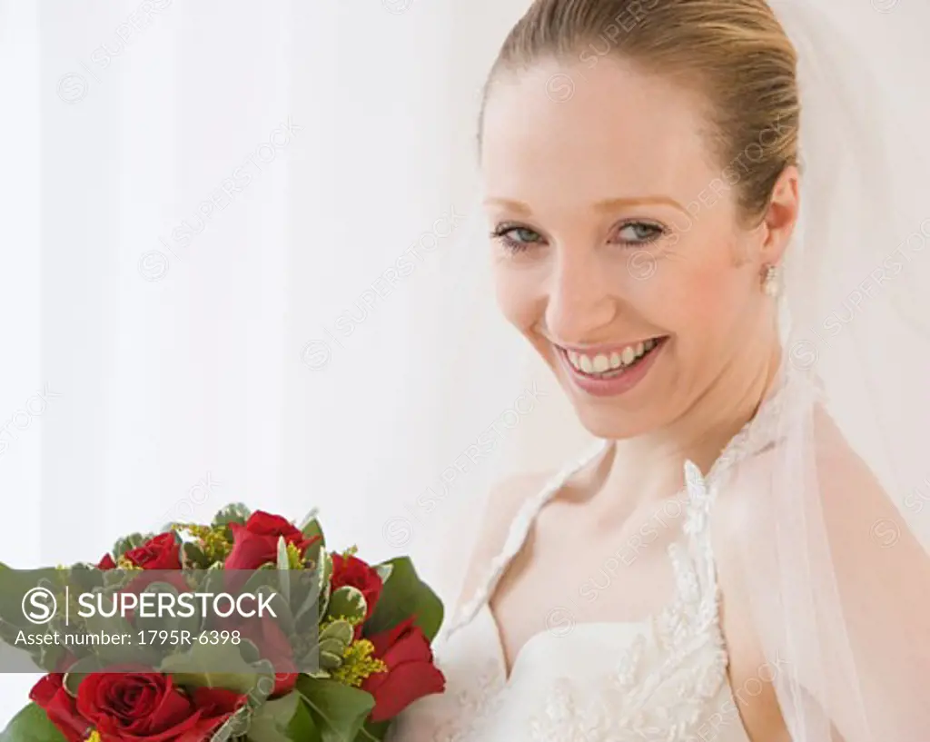 Close-up of bride holding bouquet