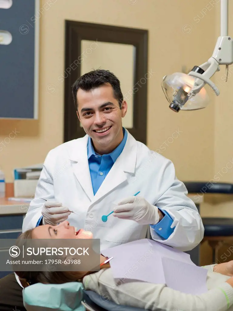 Dentist and patient in dental surgery