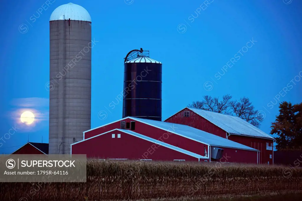 USA, Wisconsin, Moonrise over farm