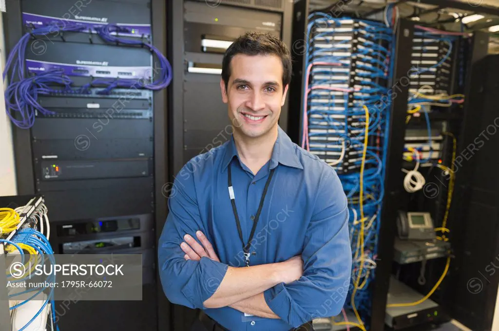 Portrait of technician in network server room