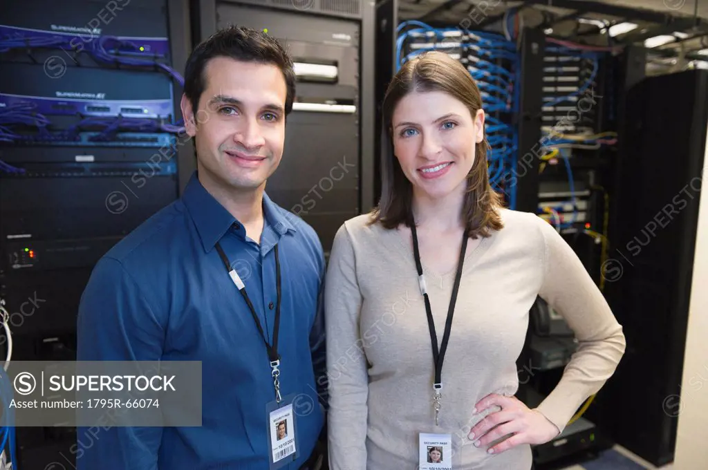 Portrait of technicians in network server room