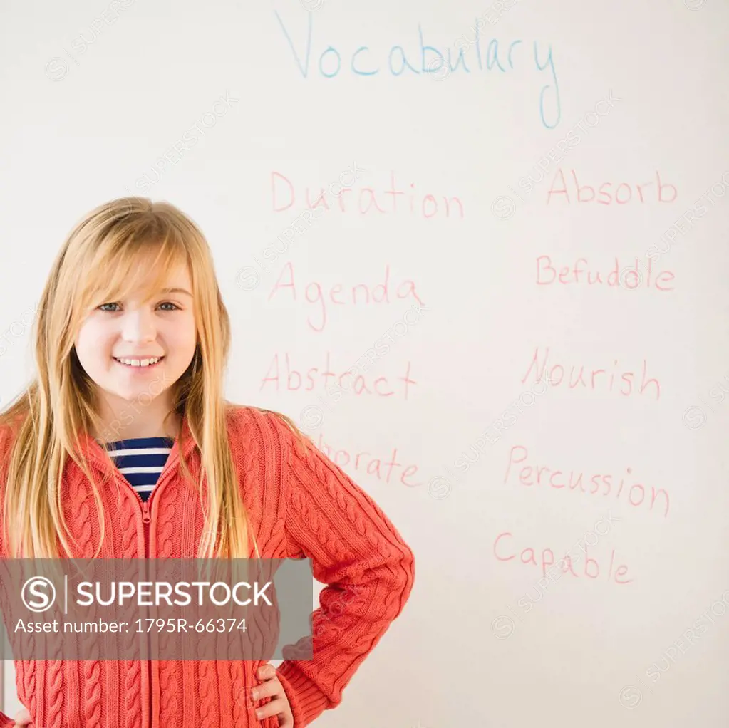 Portrait of girl in front of whiteboard