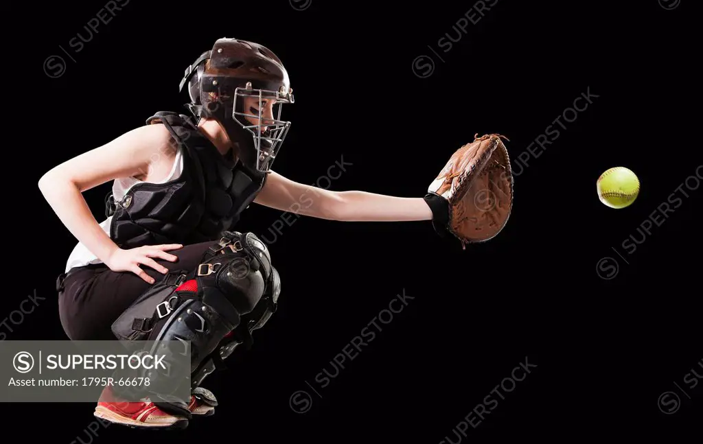 Girl 12_13 plying softball, studio shot
