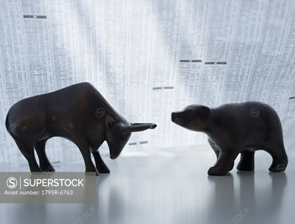 Bear and bull figurines facing each other