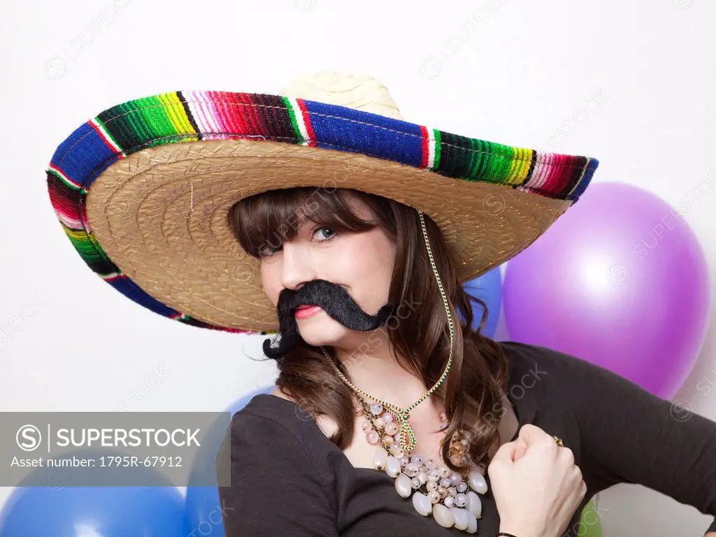 Studio Shot of young woman dressed up as Mexican