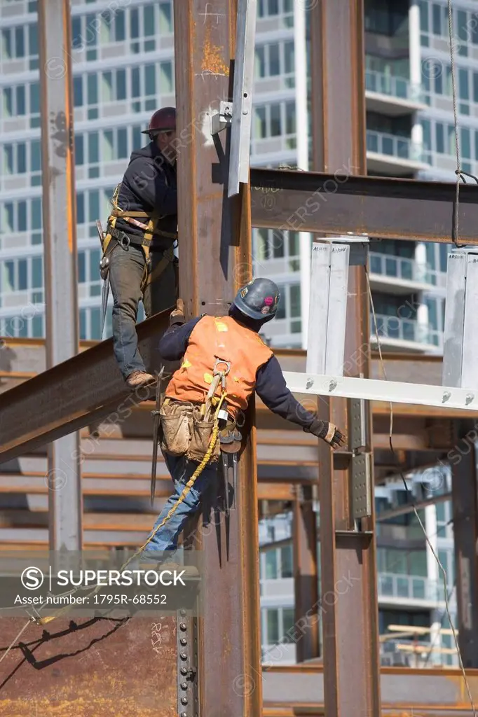 USA, New York, Long Island, New York City, Male workers on construction site
