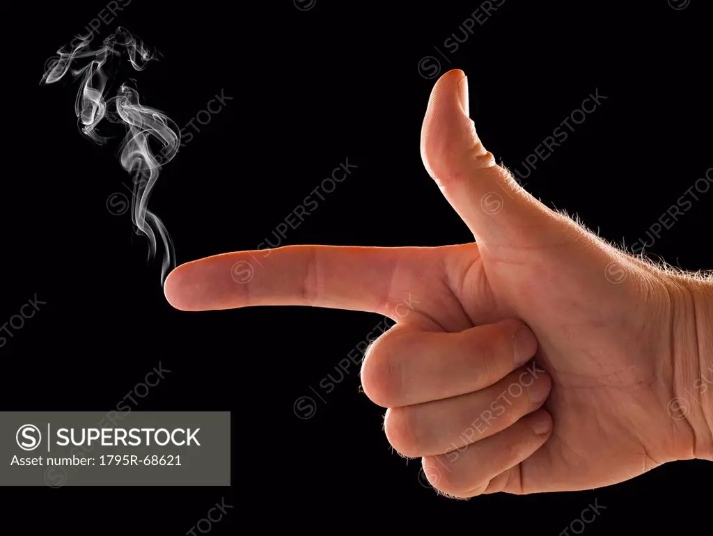 Male hand with smoke coming out of index finger