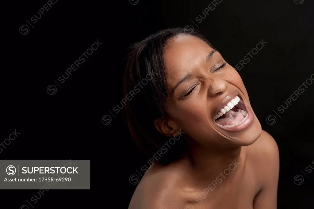 Young woman bursting with laugh